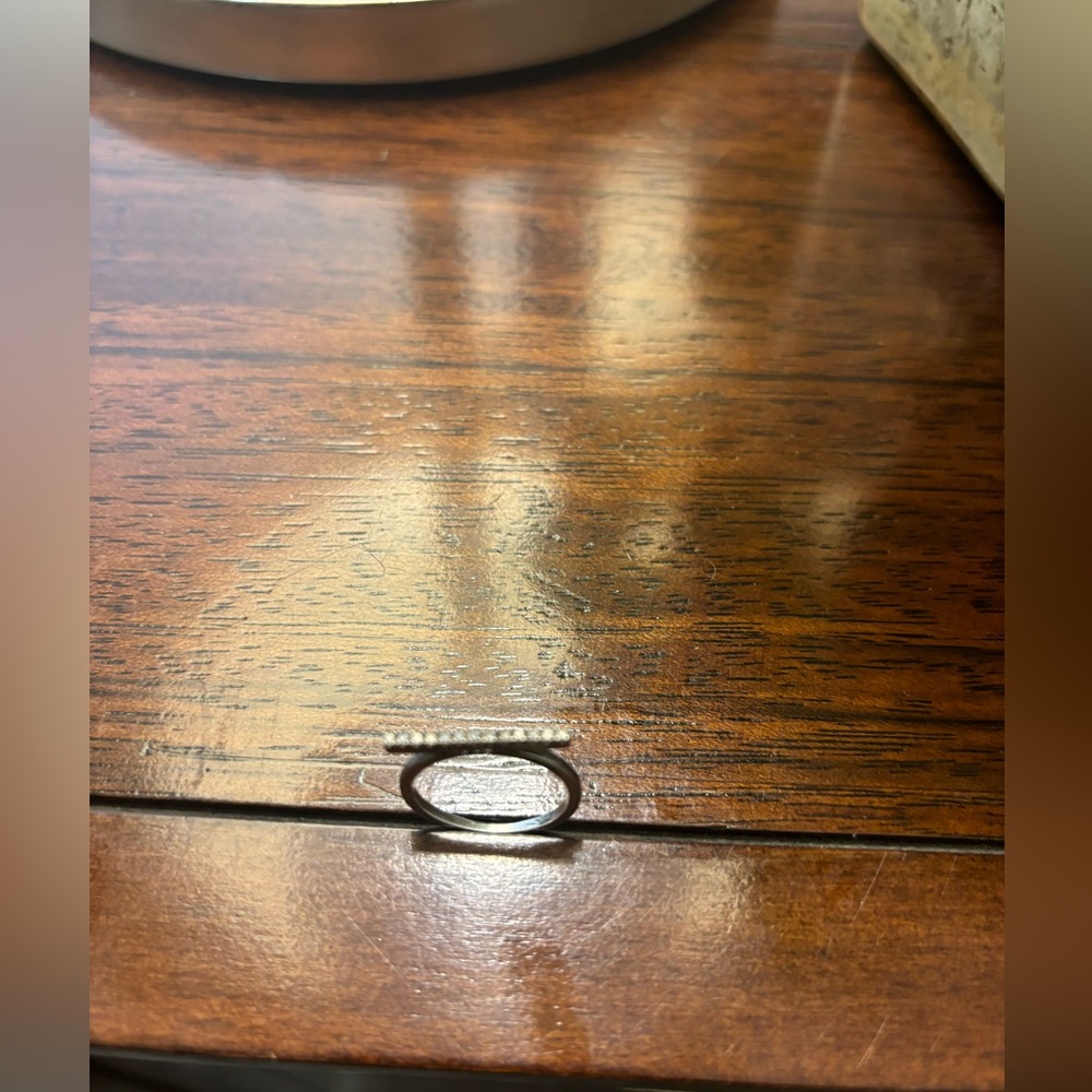 .10 carat total weight diamond bar ring in sterling silver
Size 7, GUC